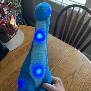 Blue Plush Dinosaur by Houwsbaby.  Lights up.  Color changing LED Night Light
